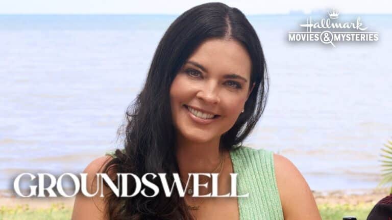 Woman with long dark hair in a green top smiling outdoors near a beach. Text: "Hallmark Movies & Mysteries - Groundswell.