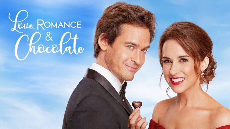 A man in a suit holds a heart-shaped chocolate beside a woman in a red dress. The text reads, "Love, Romance & Chocolate" on a blue sky background.