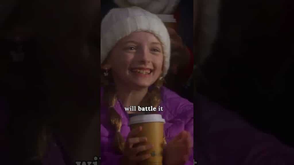 A smiling child in a white hat and purple jacket holds a coffee cup. Text overlay says, "will battle it.