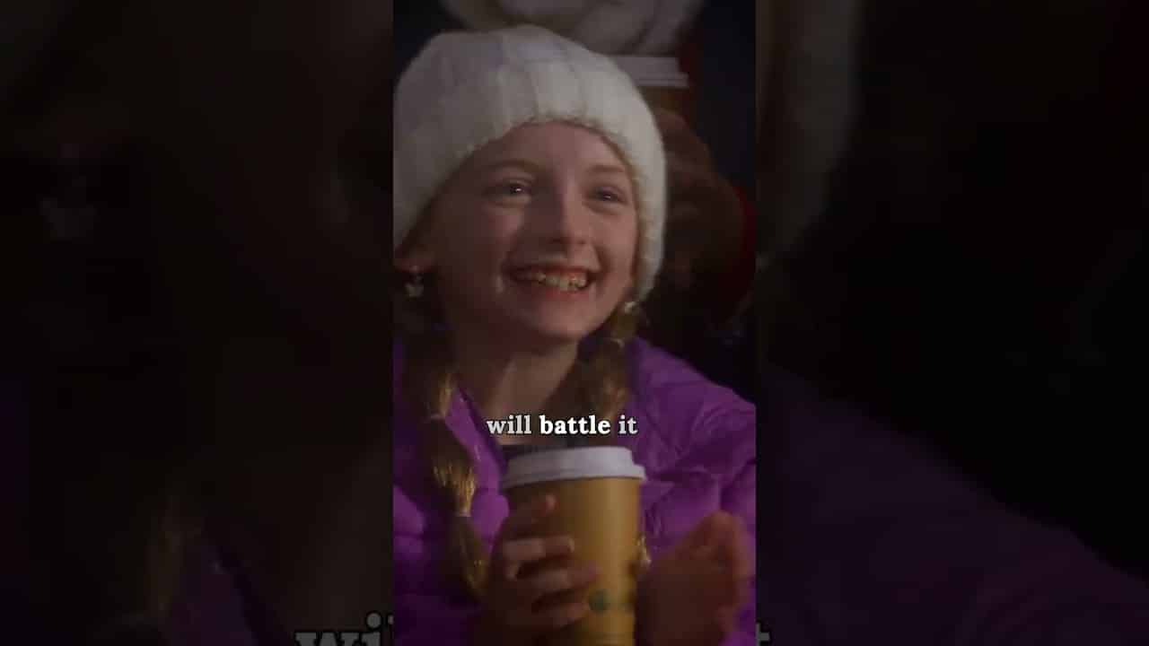 A smiling child in a white hat and purple jacket holds a coffee cup. Text overlay says, "will battle it.