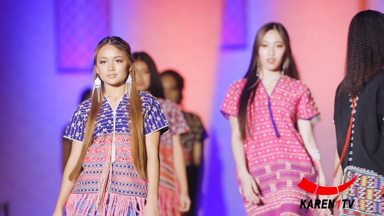 Models walking on a runway wearing colorful patterned dresses, with "KAREN TV" logo in the corner.